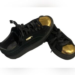 Euc sz 7.5 women's puma black and gold shoes